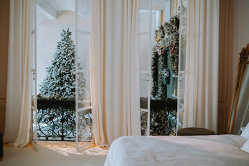 Cozy winter morning from a bedroom with a snowy balcony view