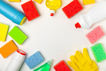 Colorful dish sponges on textured background. Kitchen sponge. Cleaning concept, cleaning service. Dishwashing liquid with clean and dirty dishes plate. Place for text, copy space. Wash the dishes.