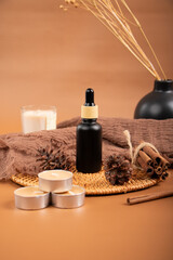Black Dropper Bottle with Tealights and Cinnamon for Skincare and Aromatherapy Display