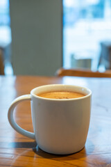 A cup of hot chocolate on the table in the cafe