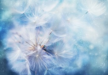 Obraz premium Close-up of dandelion seeds in the wind, with pastel colors, a light blue background, a bokeh effect