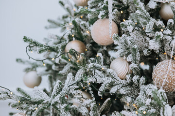Beautifully decorated Christmas tree with ornaments and lights in winter