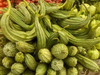 Ridge gourds vegetable arranged pile in the market