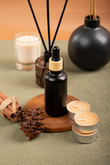 Black Dropper Bottle with Tea Light Candles on Wooden Tray for Minimalist Aromatherapy Mockup