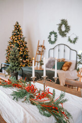 Cozy winter decor featuring a Christmas tree and holiday arrangement at home