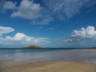 Beautiful beach on the French coast with blue sky and white clouds