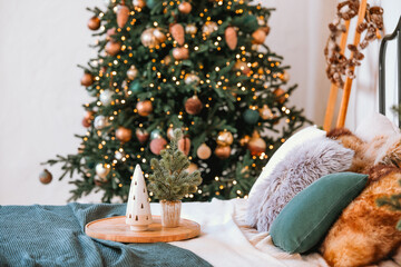 Cozy Christmas bedroom with a beautifully lit tree and festive decor