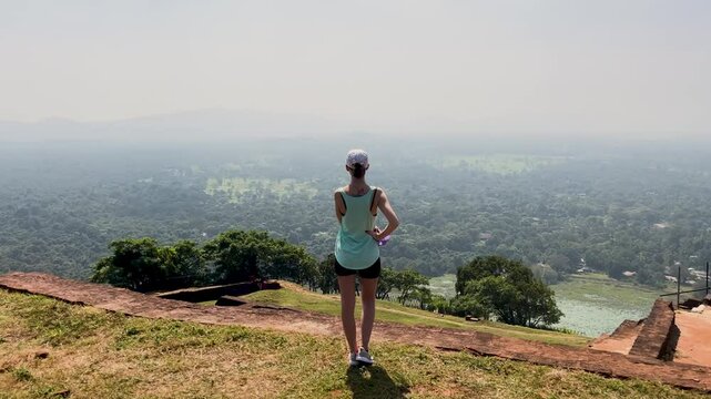Girl looking at view from  Sigiriya Mountain - Sri Lanka
