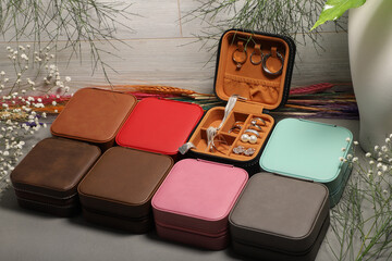 Diffirent colors leather jewelry box. Concept shot, top view. Custom background jewelry box view. Jewelry box and accessories.