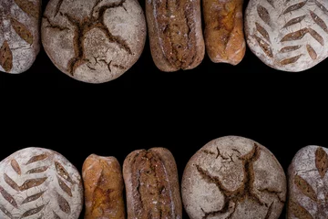 Gordijnen Assortment of rustic artisan bread loaves © Yulia Furman