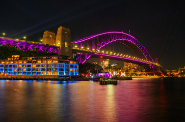 Illuminated night view on Sydney Harbor Bridge. The bridge was opened in 1932 and it is the tallest...