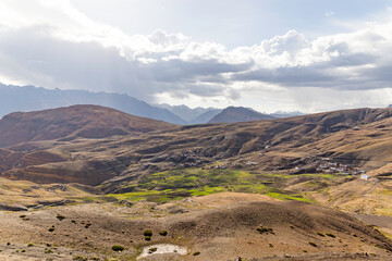 View of the hikkim village in the spiti valley with himalaya mountains and the world's highest post office in spiti valley himachal pradesh, India.