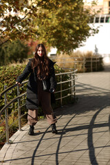 Beautiful brunette woman walking in the park