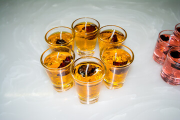 Gel candle in glass isolated on white background. set of colored gel candles. Candle in glass with many colored candles.