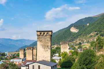 Mestia town in Georgia. The medieval Svan Towers is a traditional fortified residence in Mestia, Georgia. Svan towers and structures surrounded by green colors.