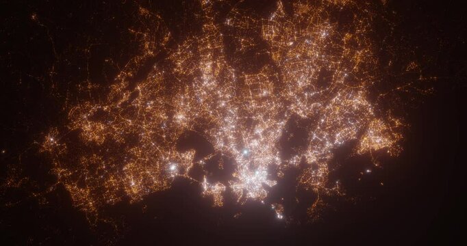 Helsinki (Finland) aerial view at night. Top view on modern city with street lights. Camera is zooming out, rotating clockwise