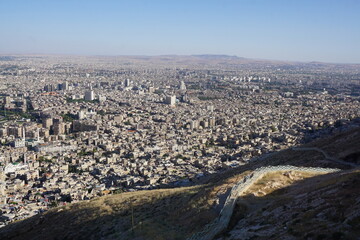 Damascus, Syria - June 1, 2023: Skyline of Damascus from Mount Qasioun  © Alex