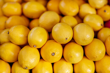 Lemons for sale in the market, closeup of photo