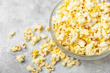 Salty popcorn on bright color background. Cinema and entertainment concept. Movie night with...