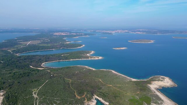 Rt Kamenjak is a stunning peninsula located near Pula, Croatia. Renowned for its rugged coastline, crystal-clear waters, and numerous small islands, it offers breathtaking aerial views
