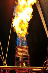 The preparation before flight of the hot air balloon. Close up shot of the gas burner that given the heated air into the envelope.  © chakorn