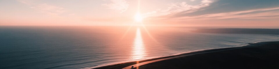 coastal highway at golden hour, lone car journey, expansive sky, ocean vista, sunburst on horizon, aerial perspective, cinematic composition
