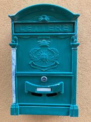 Turquoise italian post box on town house, Italy