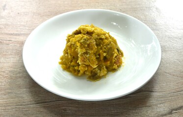 stir fried pumpkin mixed with egg on plate