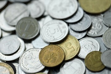 Big pile of different coins from various currencies and different countries around the world. Currency exchange