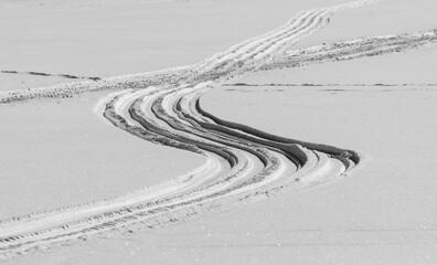 snowmobile tracks on a snow field