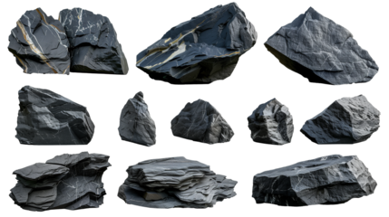 Shale rocks in various shapes and sizes, showing fine layers and dark coloration