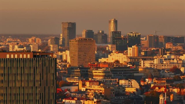Bucharest skyscraper skyline modern office corporation building. Aerial 4K video during an autumn sunset. Bucharest from above.