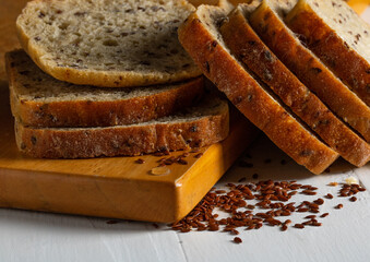 Pieces of whole wheat bread with flax seeds on the table