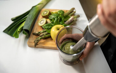 Making fresh vegetable smoothies with an immersion blender