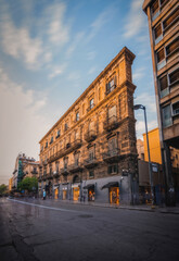 Fototapeta premium Aged buildings in the historic center of Palermo before sunset. Long exposure picture taken in June 2023