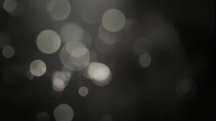 Loop black bokeh gradient background warm lighting looping video