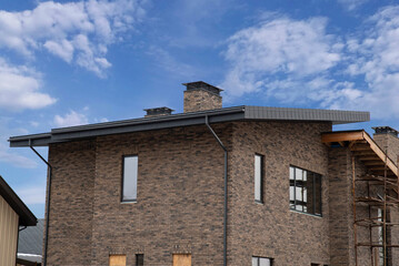 Brick country house under construction with drainage system