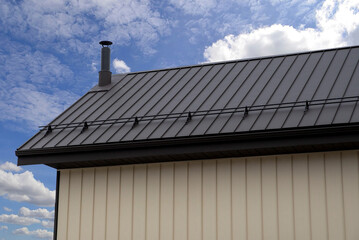 Corrugated Standing Seam Metal Roof On House With Snow Guard