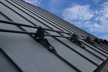 Snow guards for standing seam metal roofs © Sergey