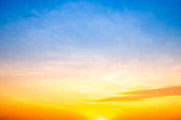 Fototapeta premium Beautiful , luxury soft gradient orange gold clouds and sunlight on the blue sky perfect for the background, take in everning,Twilight, Large size, high definition landscape photo
