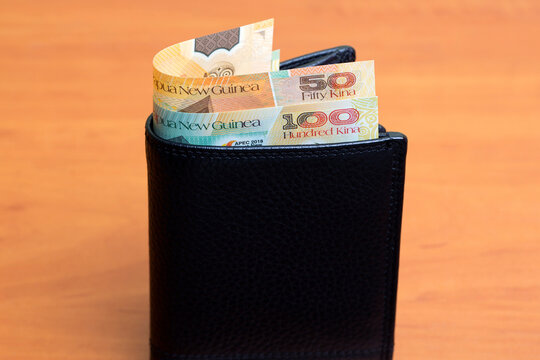 Papua New Guinean kina in the black wallet