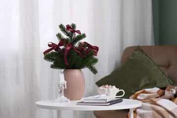 Create Cozy Holiday Decor with Lush Greenery and Soft Textures to Enhance Your Space