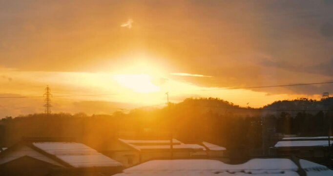 sunrise in the a village,taken from train window