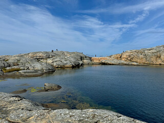 People walking on a hiking trail in Marstrand island, Sweden