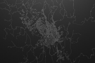 Street map of Sucre (Bolivia) on black paper with light coming from top