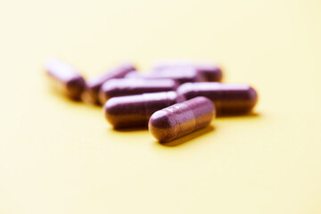 Lutein capsules. Dietary supplement on bright background. Soft focus. Close up. Copy space.	