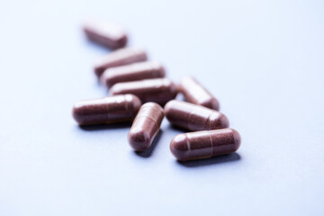Lutein capsules. Dietary supplement on bright background. Soft focus. Close up. Copy space.