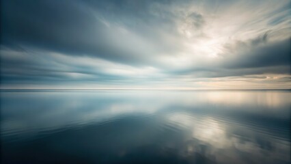 Obraz premium Abstract hues of grey paint the minimalist sky.