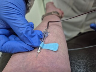 Nurse taking blood sample to make a test in laboratory. Photo was taken close up.