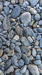 Crushed grey stone on the ground texture background, Crushed rock close up, Crushed stone road building material gravel texture. Selective Focus